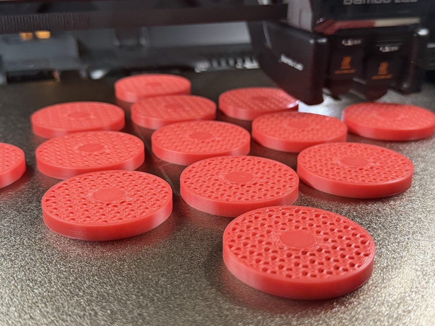 Batch of red reinforced-filament printed discs